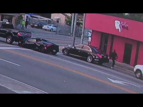 Surveillance video captures driver abandoning sports car after crash